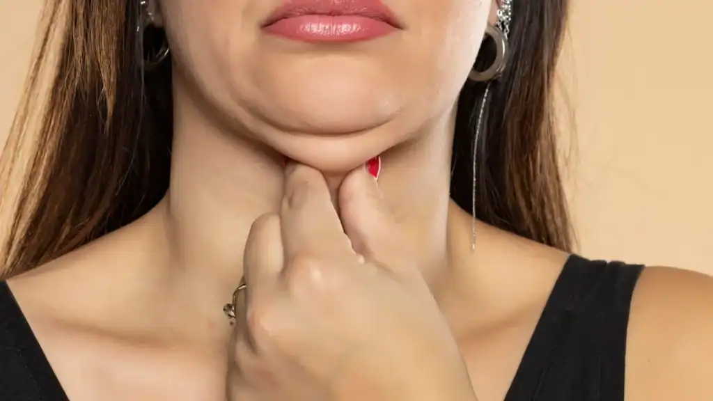 An image of a woman with double chin, sad, worried : Non Surgical Double Chin Removal Treatment in Clacton, UK